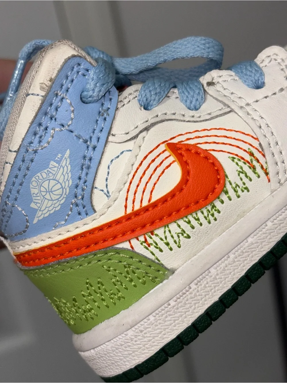 Jordan Kids White, Orange & Green High-Top Sneaker with Light Blue Accents